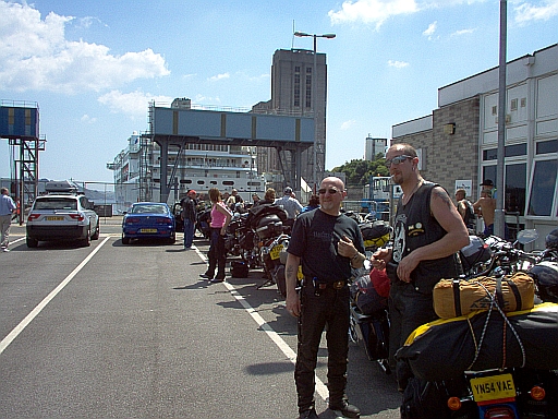 A queue of bikers and bikes waiting in the second queue for the ferry